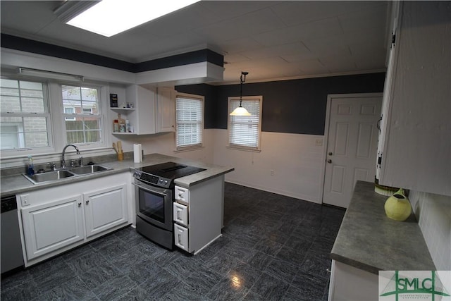 kitchen with white cabinets, appliances with stainless steel finishes, pendant lighting, and sink