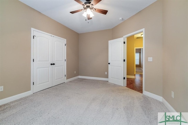 unfurnished bedroom featuring ceiling fan, carpet floors, and a closet