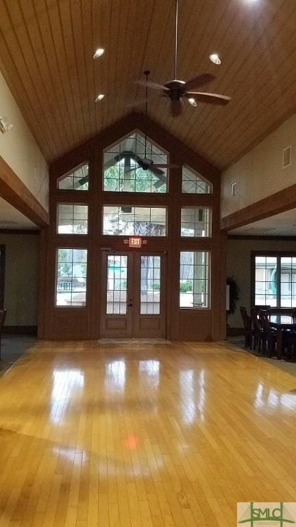 174 Brookline Dr, Savannah, GA 31407 - unfurnished living room with high vaulted ceiling, wood finished floors, a ceiling fan, and wood ceiling