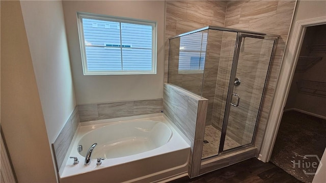 174 Brookline Dr, Savannah, GA 31407 - full bathroom featuring a garden tub, a stall shower, healthy amount of natural light, and a walk in closet