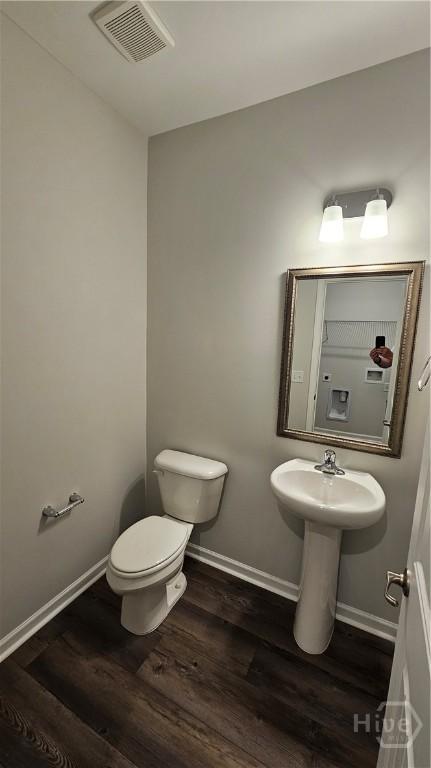 174 Brookline Dr, Savannah, GA 31407 - bathroom with toilet and wood finished floors