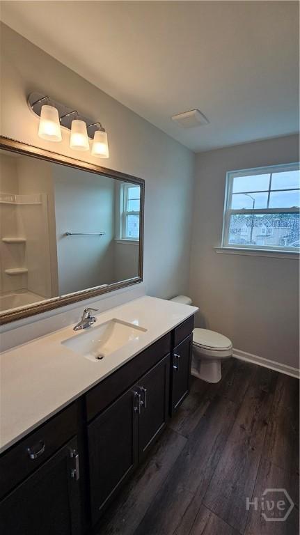 174 Brookline Dr, Savannah, GA 31407 - bathroom with vanity, wood finished floors, and plenty of natural light