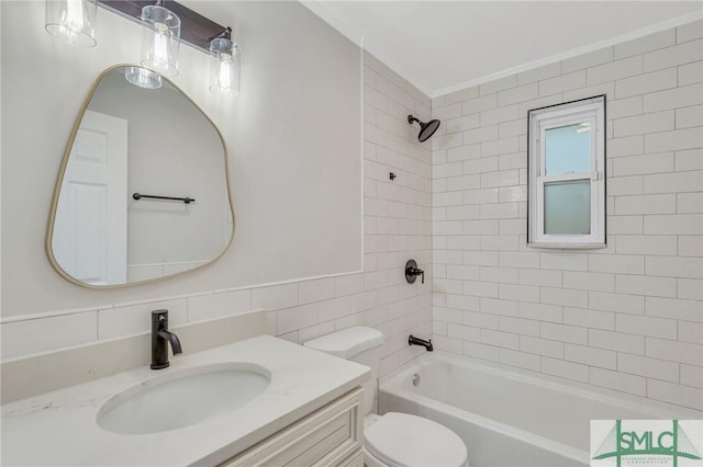 full bathroom featuring tasteful backsplash, toilet, vanity, tile walls, and tiled shower / bath