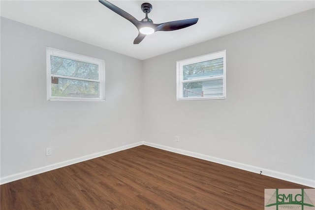 unfurnished room featuring ceiling fan, hardwood / wood-style floors, and a healthy amount of sunlight