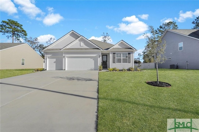 view of front of home featuring a front yard and a garage