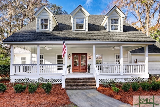 cape cod home featuring ceiling fan and covered porch