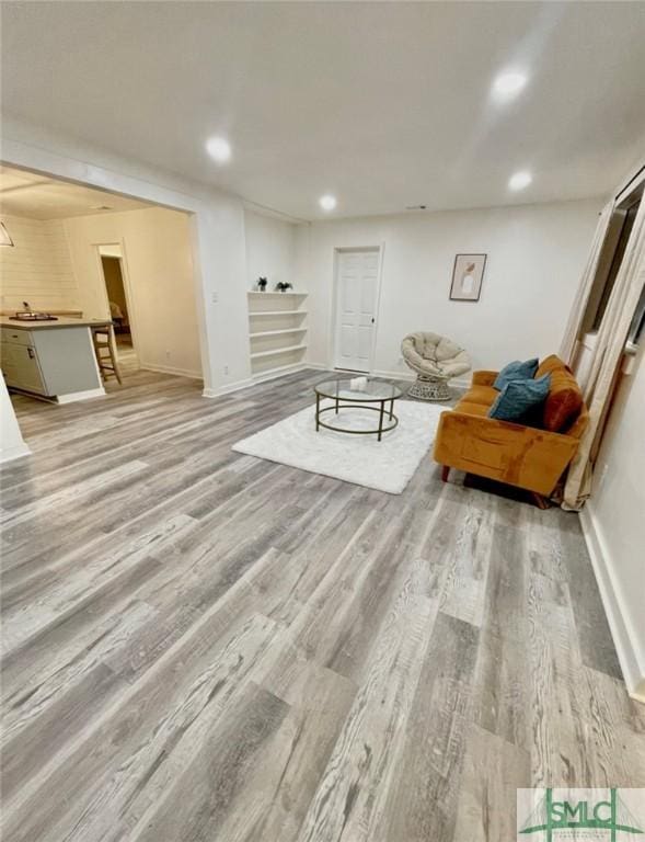 unfurnished living room featuring light wood-type flooring