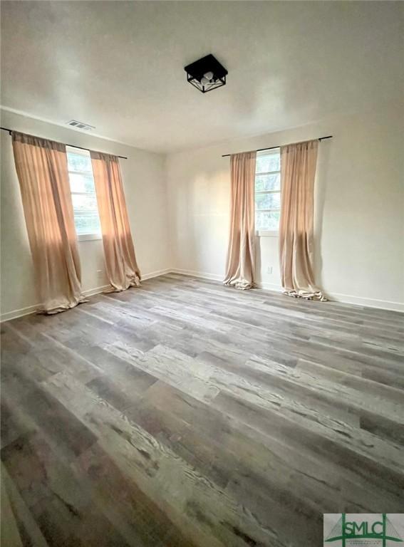 empty room with wood-type flooring