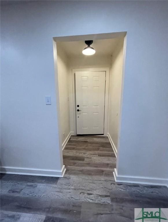 entryway with dark hardwood / wood-style floors