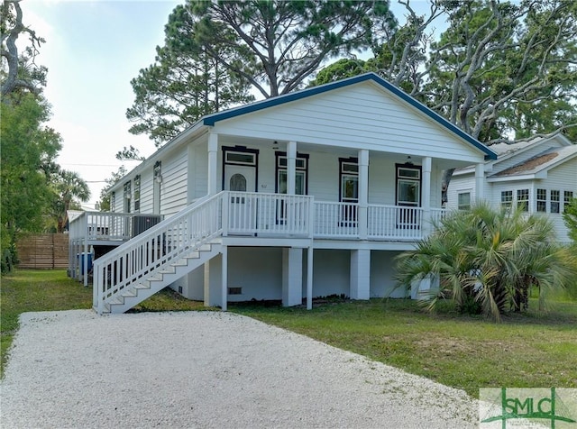 view of front of home with covered porch and a front yard