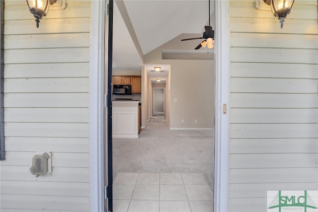 doorway to property with ceiling fan