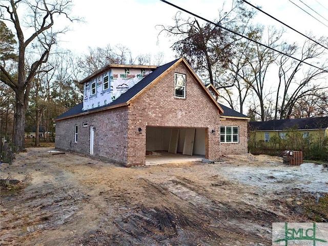 back of house with a garage