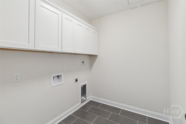 130 N Skinner Ave, Pooler, GA 31322 - laundry area with cabinet space, electric dryer hookup, baseboards, hookup for a washing machine, and dark tile patterned floors