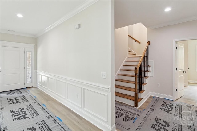 130 N Skinner Ave, Pooler, GA 31322 - entryway with light wood finished floors, crown molding, stairway, recessed lighting, and wainscoting