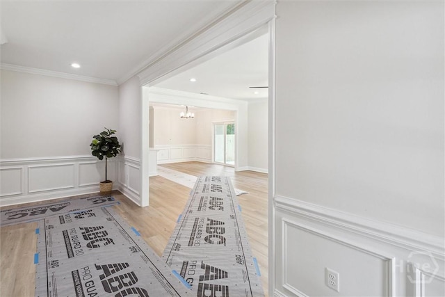 130 N Skinner Ave, Pooler, GA 31322 - hall with a chandelier, ornamental molding, wood finished floors, and wainscoting