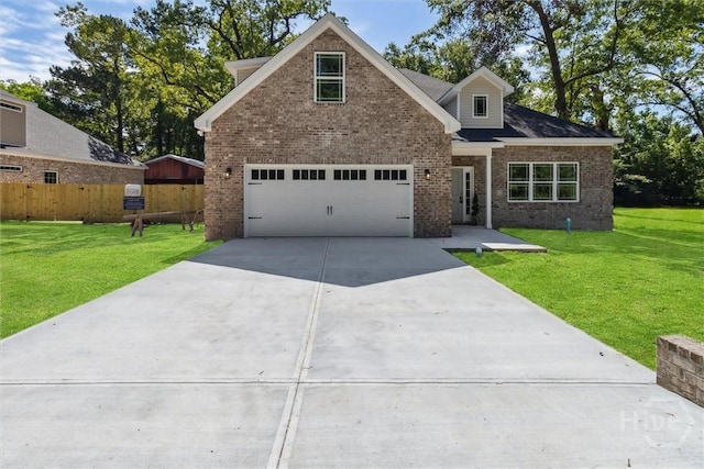 130 N Skinner Ave, Pooler, GA 31322 - view of front facade featuring driveway, brick siding, and a garage