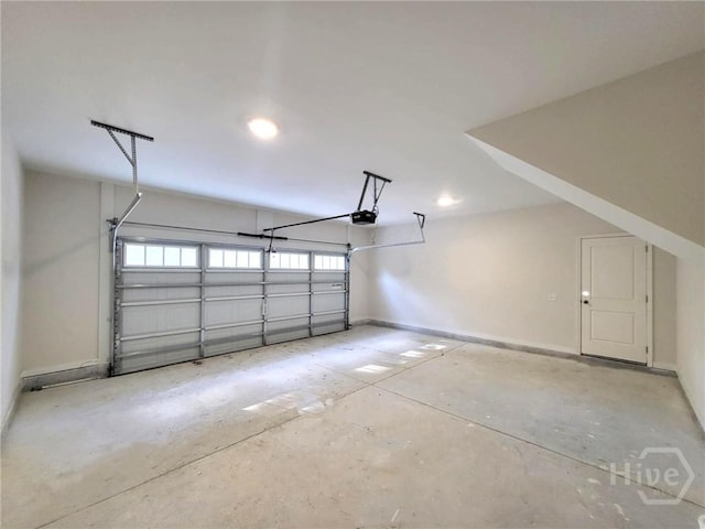 130 N Skinner Ave, Pooler, GA 31322 - garage with a garage door opener, baseboards, and recessed lighting