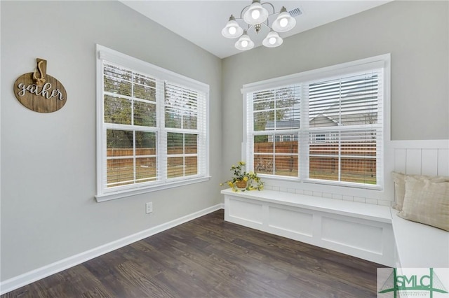 interior space featuring a notable chandelier and dark hardwood / wood-style floors