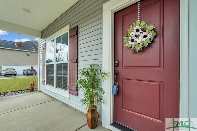 entrance to property with covered porch