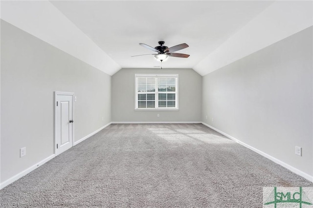 additional living space with carpet flooring, ceiling fan, and lofted ceiling