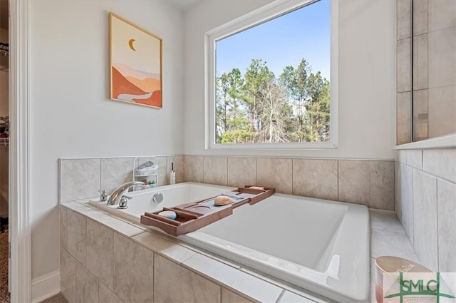 137 William Way, Springfield, GA 31329 - bathroom featuring plenty of natural light, a garden tub, and a walk in closet