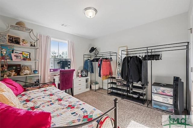 bedroom featuring light colored carpet