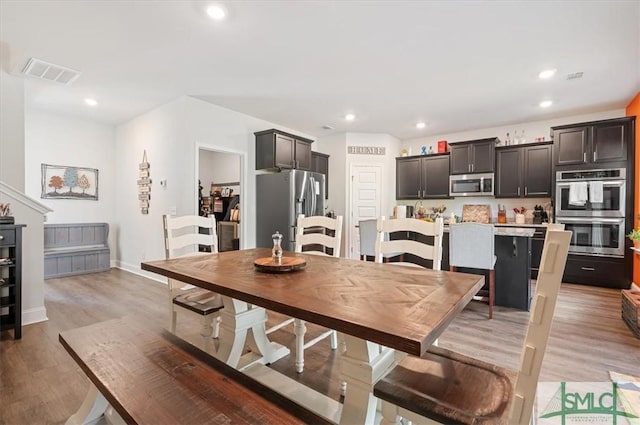 dining room featuring light hardwood / wood-style flooring