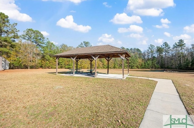 view of home's community with a gazebo and a yard