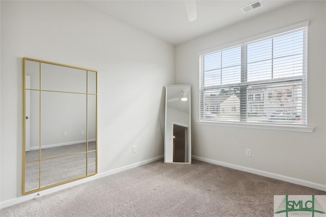 unfurnished bedroom with ceiling fan, a closet, and carpet