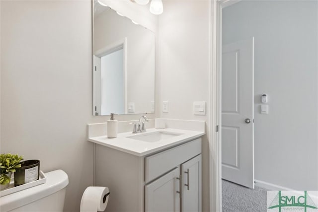 bathroom with vanity and toilet