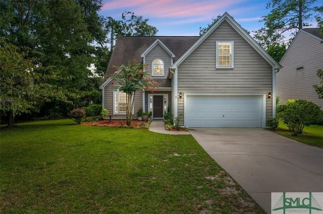 view of front of house featuring a garage and a lawn