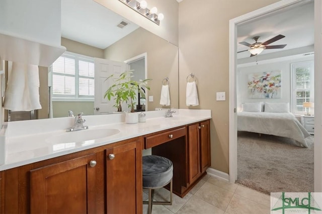 bathroom featuring tile patterned floors, vanity, and ceiling fan