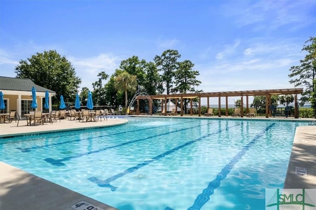 view of swimming pool with a pergola