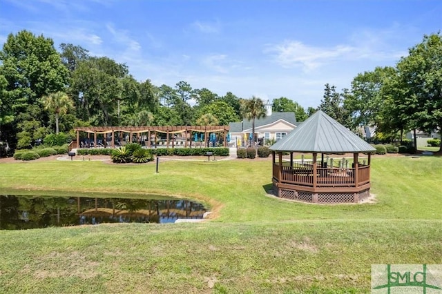 view of home's community featuring a gazebo, a water view, and a lawn