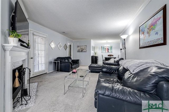 living room featuring carpet, a chandelier, a textured ceiling, and ornamental molding