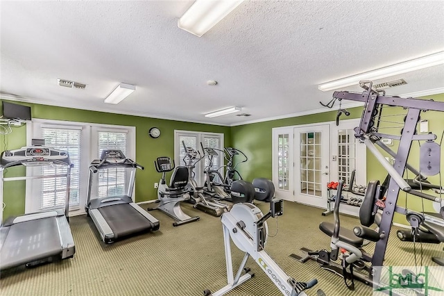 gym featuring ornamental molding, a textured ceiling, and french doors