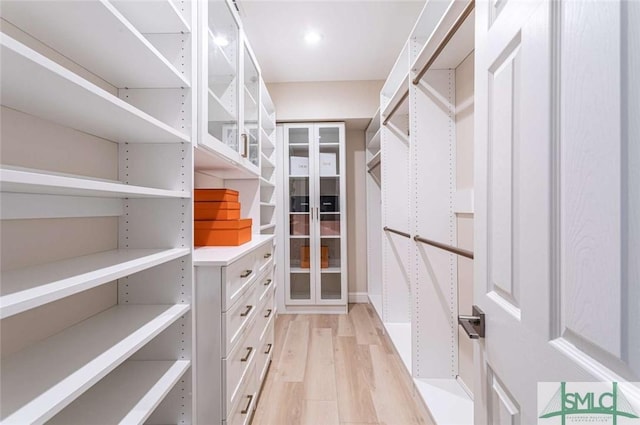 walk in closet featuring light wood-type flooring