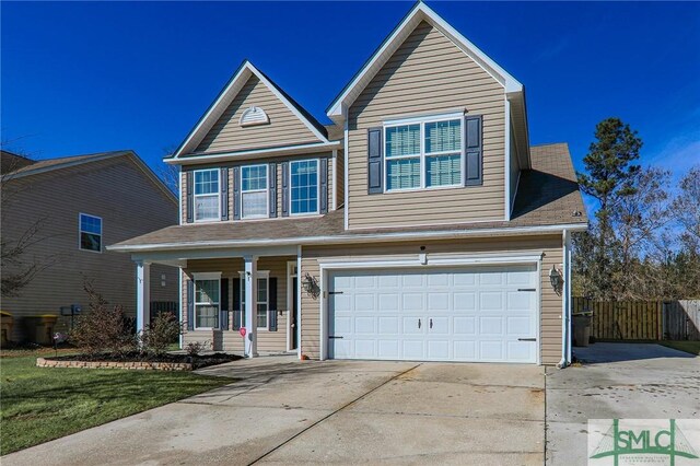 view of front of house with covered porch and a garage