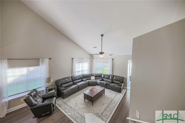 living room with dark hardwood / wood-style floors, ceiling fan, and lofted ceiling