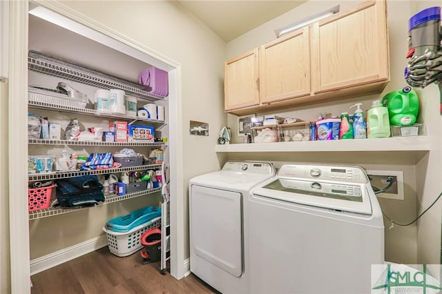 clothes washing area featuring cabinets, independent washer and dryer, and dark wood-type flooring