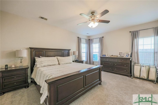 carpeted bedroom featuring ceiling fan