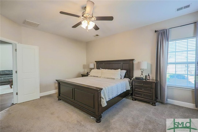 bedroom with light colored carpet and ceiling fan