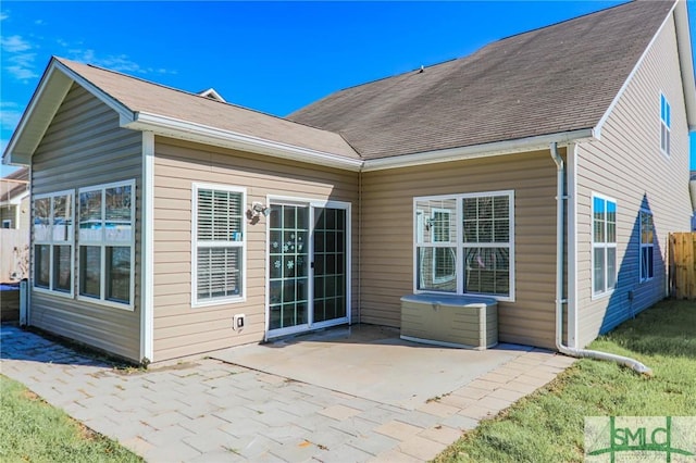 back of house with a patio