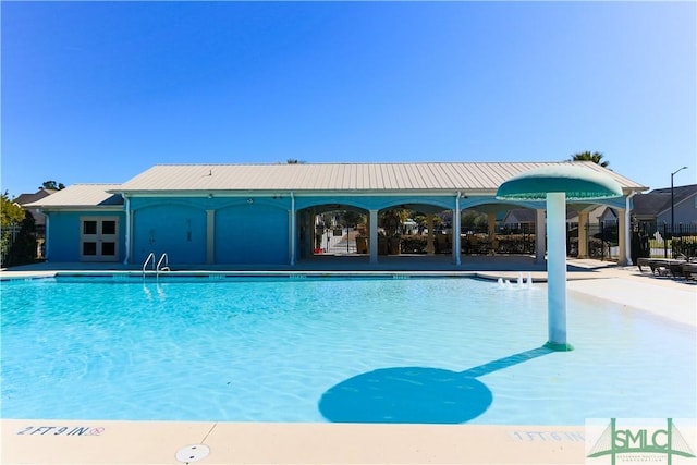 view of pool featuring a patio