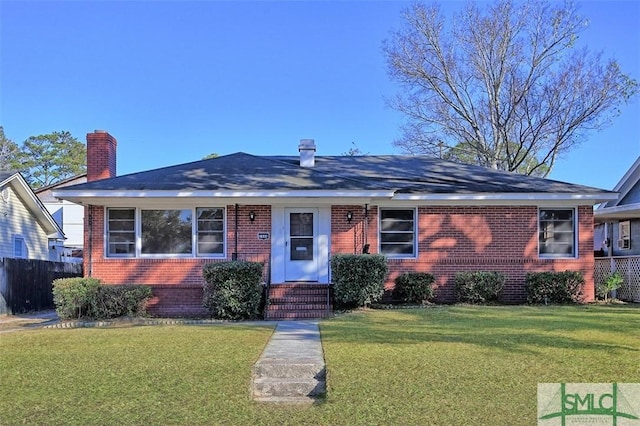 ranch-style home with a front yard