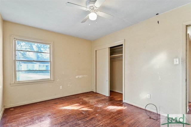 unfurnished bedroom featuring a closet, ceiling fan, and hardwood / wood-style floors