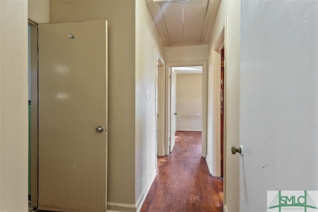 hall featuring dark hardwood / wood-style flooring and ornamental molding