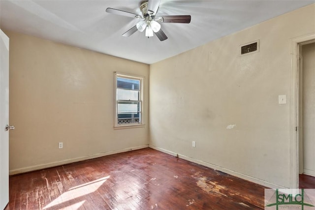 spare room with ceiling fan and wood-type flooring