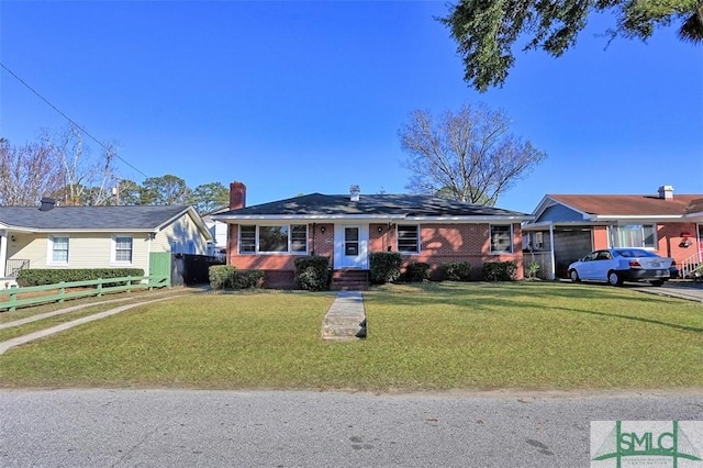 ranch-style house with a front lawn