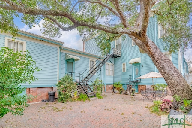 rear view of property featuring a patio